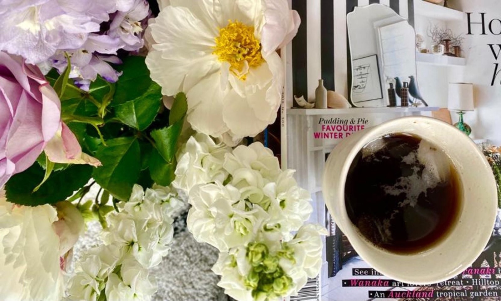 A coffee among fresh flowers